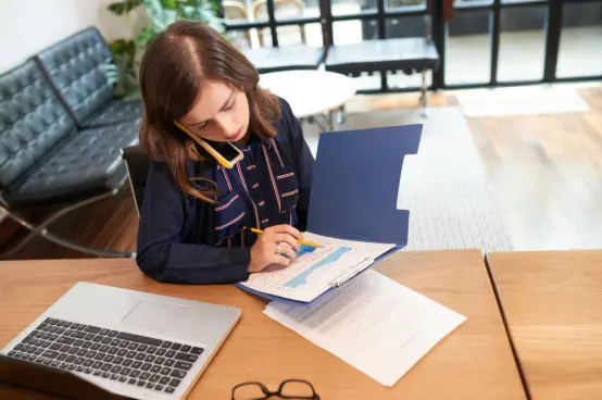 A woman figuring out how to file a T2 Corporate Tax Return in Canada.